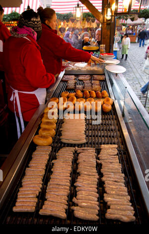 No visit to Nuremberg's popular Christkindlesmarkt (Christmas Market) is complete without sampling the city's famous bratwurst. Stock Photo