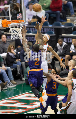 January 6, 2015: Milwaukee Bucks guard Jerryd Bayless (19) goes up for a shot on Phoenix Suns guard Eric Bledsoe (2) during the NBA game between the Phoenix Suns and the Milwaukee Bucks at the BMO Harris Bradley Center in Milwaukee, WI. Suns defeated the Bucks 102-96. John Fisher/CSM Stock Photo