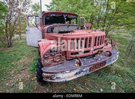 abandoned fire engine near former fish plant in Chernobyl Exclusion Zone, Ukraine Stock Photo