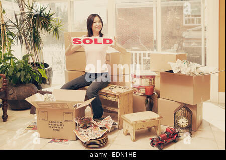 Asian womans first home Stock Photo