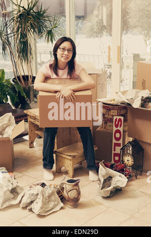 Asian womans first home Stock Photo
