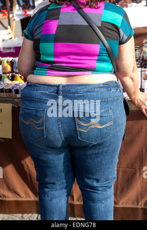 Obese woman rear view obesity woman jeans Rear View Back on street Overweight woman Stock Photo