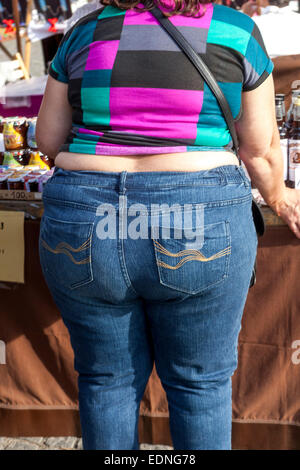 Obese woman rear view obesity woman jeans rear view on street Overweight woman Stock Photo