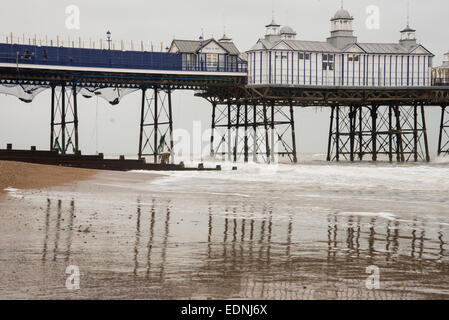 The iron struts and legs of Eastbourne Pier, a grade II* listed building, showing the netting added after the fire in Sept 2014 Stock Photo