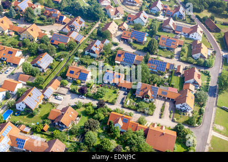 Aerial view, new housing estate with photovoltaic panels on the roofs, Sünching, Bavaria, Germany Stock Photo