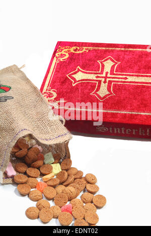 Book of Sinterklaas with candy in bag Stock Photo
