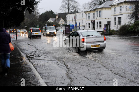 Traffic drives through floodwater in Preston Road Brighton this morning as torrential rain caused drains to burst Stock Photo