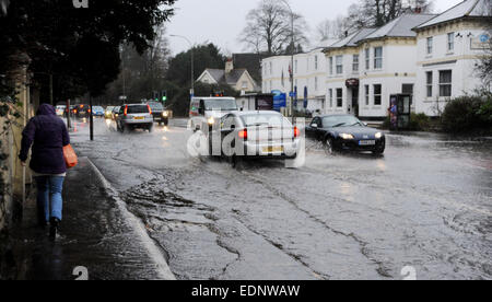 Traffic drives through floodwater in Preston Road Brighton this morning as torrential rain caused drains to burst Stock Photo