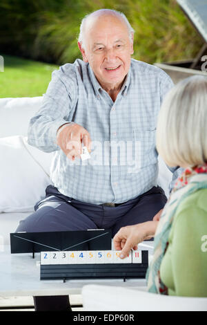 Happy Senior Man Playing Rummy With Woman Stock Photo - Alamy