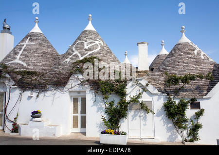 Image of a Row of Trulli Stone Houses in the town of Alberobello, Puglia, Italy Stock Photo