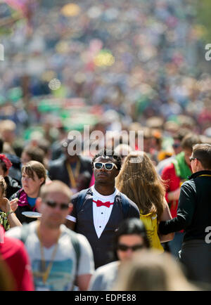 Crowds streaming along a busy walkway at Glastonbury June 2014 UK Stock Photo