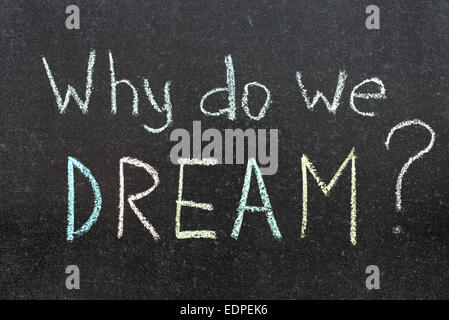 why do we dream question exclamation handwritten on blackboard Stock Photo