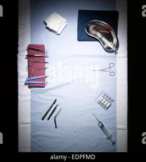 An overhead shot of an operating table with instruments Stock Photo