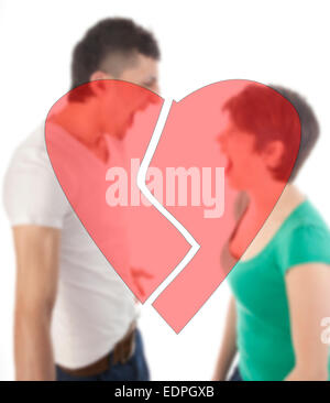 Young man and woman shouting at each other with broken heart isolated on white background Stock Photo