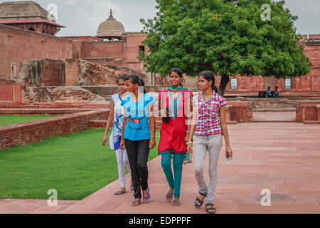 Indian young girls passing through the plaza of Jahangiri Mahal in Agra Fort. Stock Photo