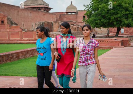 Indian young girls passing through the plaza of The Jahangiri Mahal in Agra Fort. Stock Photo