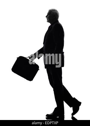 One Caucasian Senior Business Man walking Silhouette White Background Stock Photo