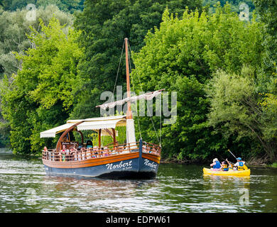 A tourist boat, in French called 'gabare', on the river Dordogne at La Roque-Gageac. Stock Photo