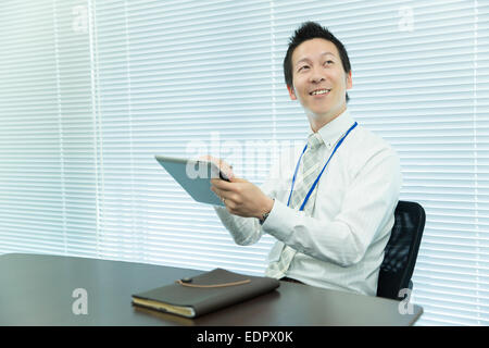 Businessman Using Tablet Computer Stock Photo