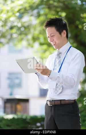 Businessman Using Tablet Computer Stock Photo