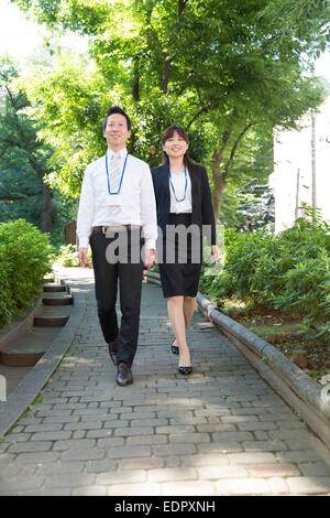 Business People Walking on the Pave Stock Photo