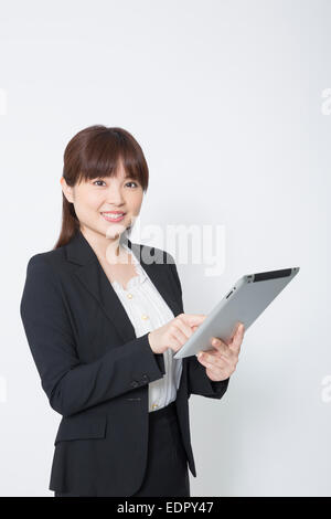 Businesswoman Using Tablet Computer Stock Photo