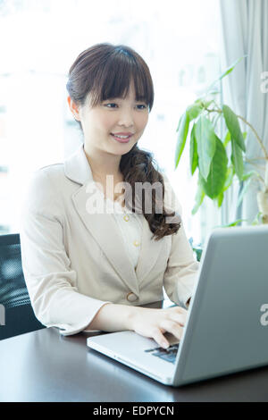 Businesswoman Using Laptop Computer Stock Photo