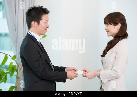 Business People Exchanging Business Cards Stock Photo