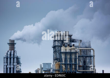 Steaming smoke stacks at Kronospan Factory making wood based panels, chipboard and MDF at Chirk in Wrexham, Wales Stock Photo