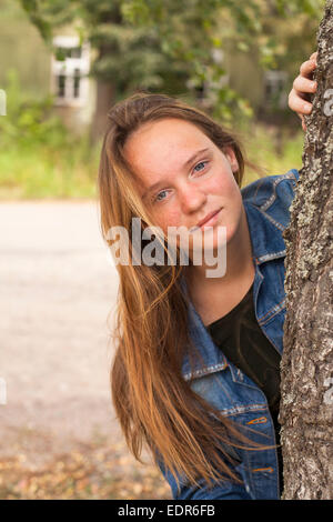 Cute long-haired teen girl portrait outdoors. Stock Photo