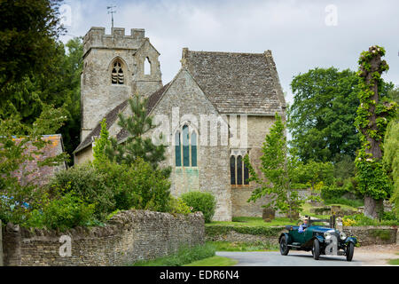 Vintage Bentley four and a half litres luxury car built in 1929 being driven on touring holiday in The Cotswolds at Asthall in O Stock Photo