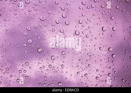 https://l450v.alamy.com/450v/edracd/water-drops-on-glass-background-purple-sky-edracd.jpg