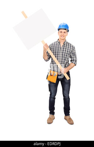 Full length portrait of a male construction worker holding a blank sign isolated on white background Stock Photo