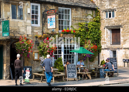 Tourists at The Cotswolds Arms inn traditional old gastro pub in Burford in The Cotswolds, Oxfordshire, UK Stock Photo