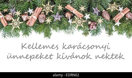 hungarian Christmas card  with Christmas baubles, fir branches, stars and text Merry Christmas and a happy New Year Stock Photo