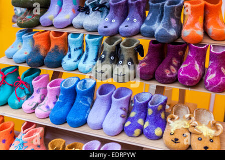 Colorful child felt boots displayed in marketplace Stock Photo