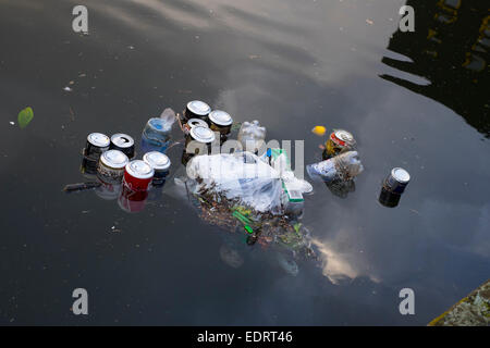 Litter floating in canal in Walsall town centre, West Midlands, England, UK Stock Photo