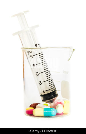 syringe in beaker and group of drugs on white background (isolated) Stock Photo