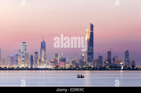 Skyline of Kuwait city at night Stock Photo