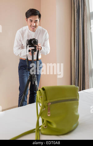 Online seller taking pictures of products Stock Photo