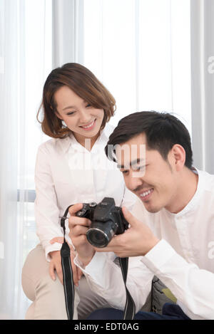 Photographer and model checking playback on camera Stock Photo