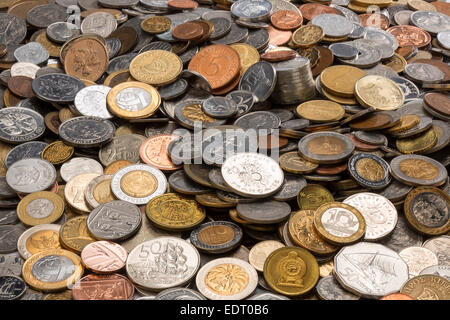Currency - A collection of old coins from around the world. Stock Photo