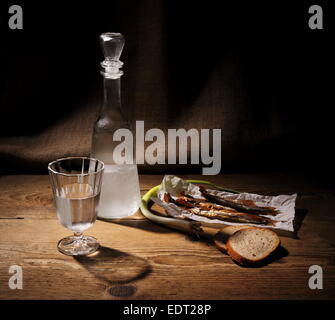 Still Life, glass of vodka with dried capelin and bread Stock Photo
