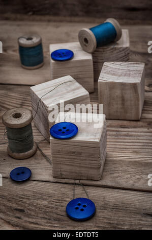 spool sewing thread and buttons in vintage style Stock Photo