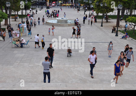 Lottery vendors and people walking at Syntagma square in downtown Athens, Greece. Stock Photo