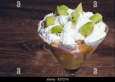 fruit salad with whipped cream and kiwi Stock Photo