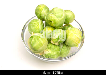 Brussels sprouts on bowl on white background Stock Photo