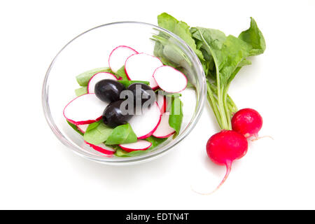 Salad radishes in bowl on white background Stock Photo