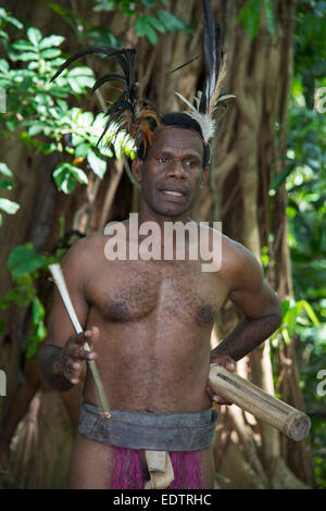 Melanesia, Vanuatu, Rano Island. Village man in traditional wooden ...