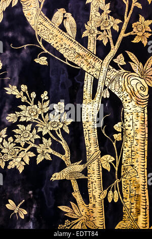 The old image of trees and birds and dragonfly on wall in thai temple Stock Photo